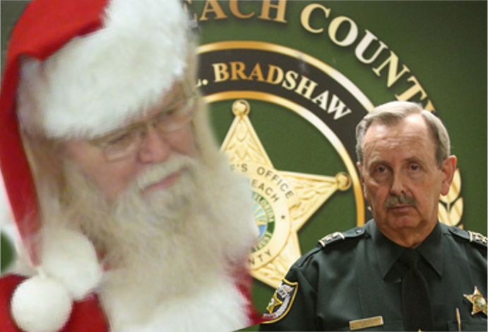 Santas seen and heard all he can handle about the "EVIL" going on in Ric Bradshaw's Palm Beach County. Santa met with the hundreds of victims of Bradshaw's crazed and out of control deputies who kill innocent citizens and then conspire and lie with his assistance to coverup their dastardly acts of murder and mayhem against innocent citizens. 2015 Naples Ninja News. All rights reserved.